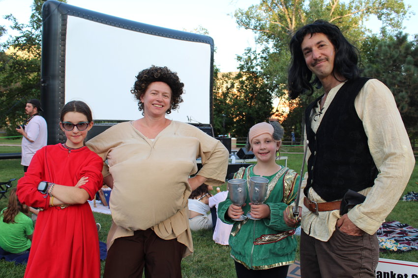 The Wunsch family dresses as characters from "The Princess Bride" at Movies & Music in the Park Aug. 12 at Parfet Park. From left, 11-year-old Ayalah is Princess Buttercup, Heidi is Fezzik, 8-year-old Dafna is Vizzini, and Assaf is Inigo Montoya.